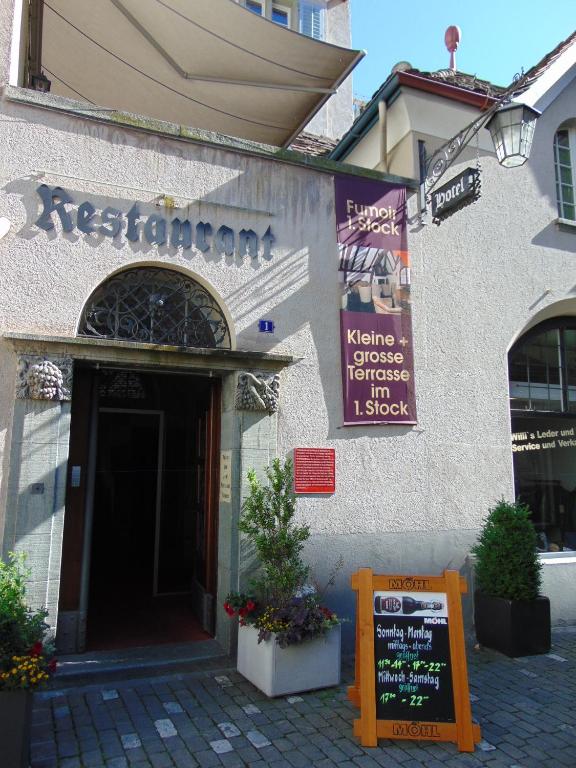 a building with a sign in front of it at Zunfthaus zur Rebleuten in Chur