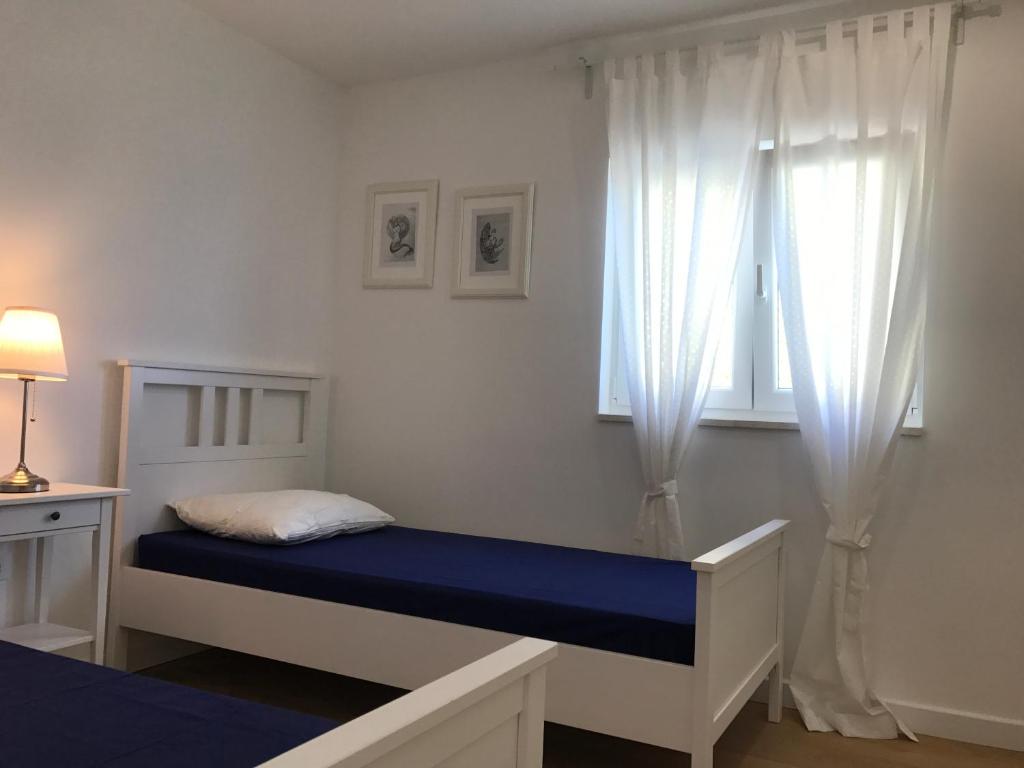 Posteľ alebo postele v izbe v ubytovaní Villa Antares Pisak