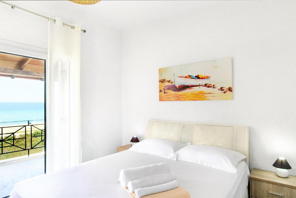 Postel nebo postele na pokoji v ubytování Sea Side Villa