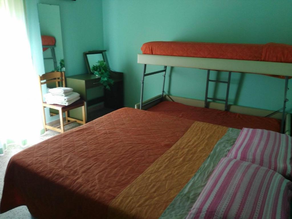 Postel nebo postele na pokoji v ubytování Hotel Acapulco sul mare