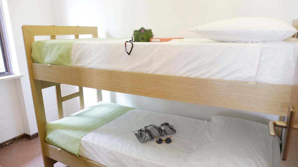 Postel nebo postele na pokoji v ubytování Camping Zocco