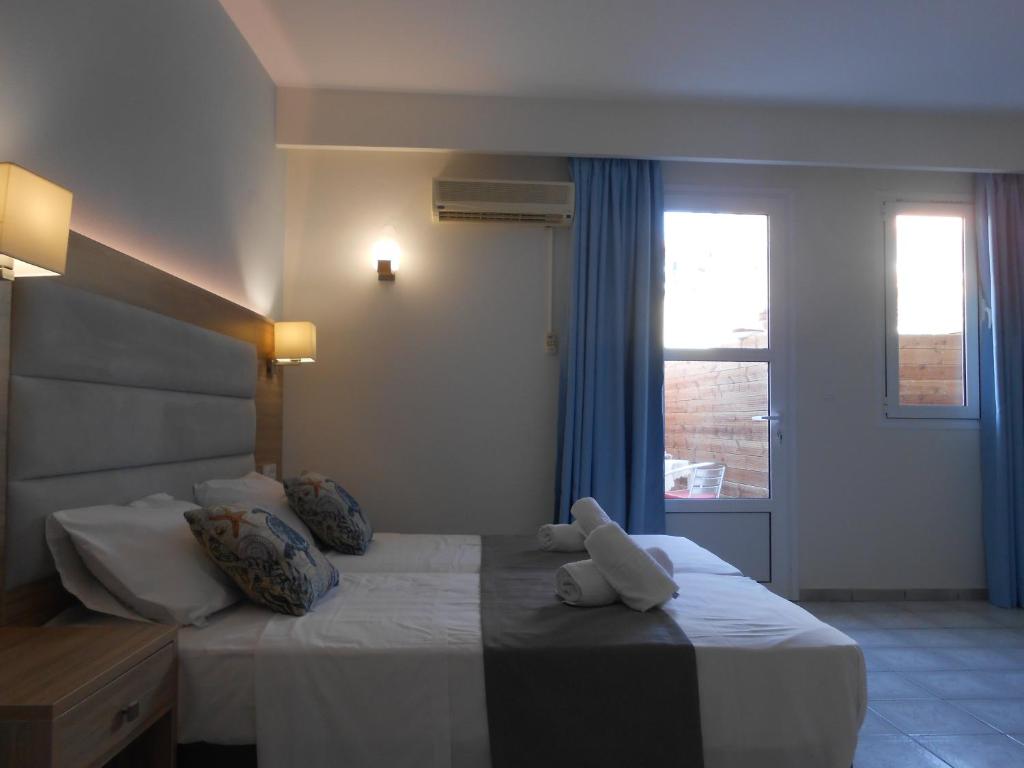 Posteľ alebo postele v izbe v ubytovaní Aristo Apts