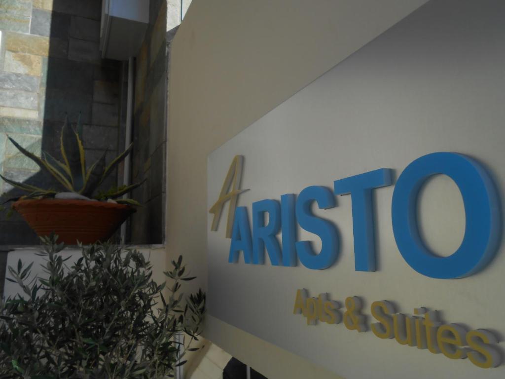 a sign for the austereo mass and services company at Aristo Apts in Hersonissos