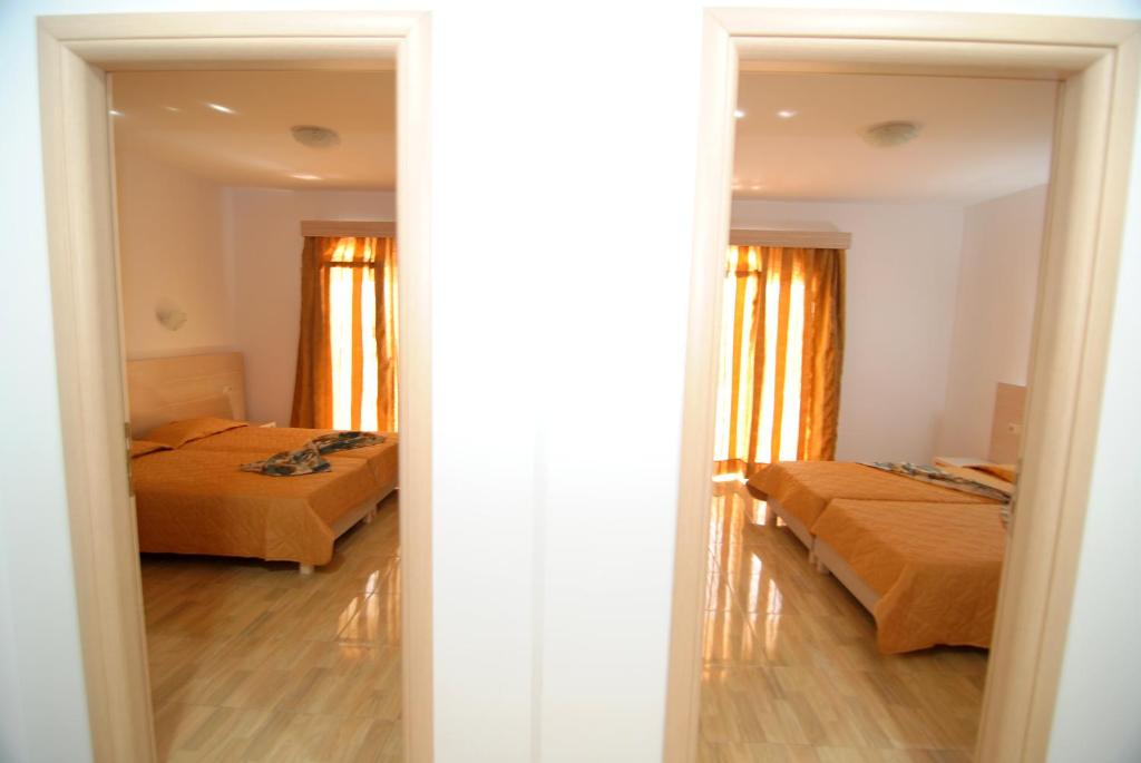 Postel nebo postele na pokoji v ubytování Zeus Hotel