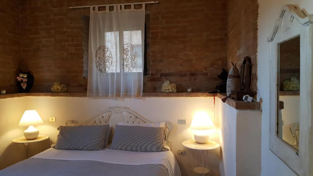Postel nebo postele na pokoji v ubytování Casa Vacanze Fornace