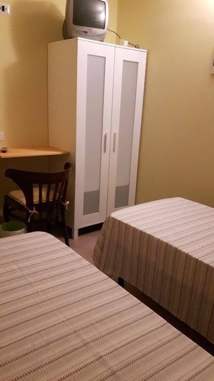 Łóżko lub łóżka w pokoju w obiekcie B&B La villetta rossa