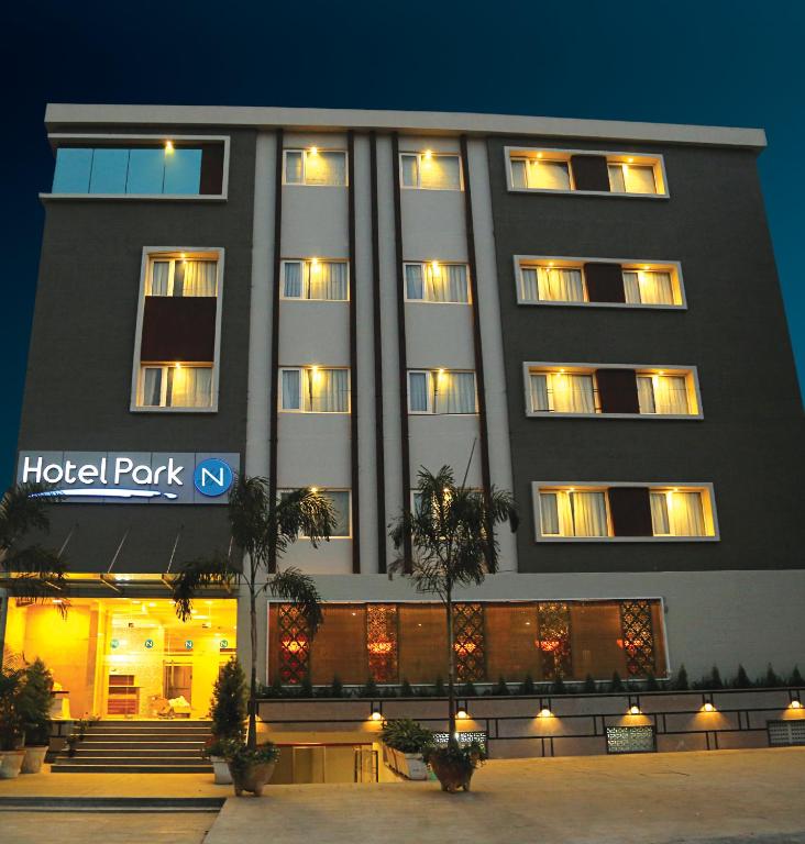 a hotel building with a hotel park sign in front of it at Hotel Park N in Vijayawāda