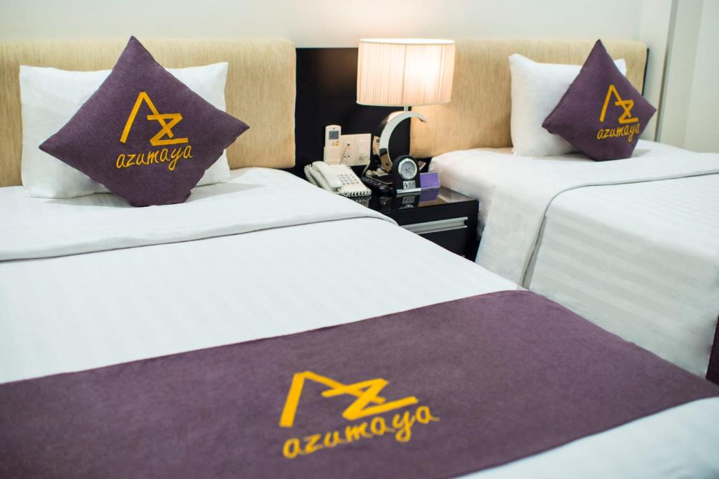 Postel nebo postele na pokoji v ubytování Azumaya Hotel Da Nang