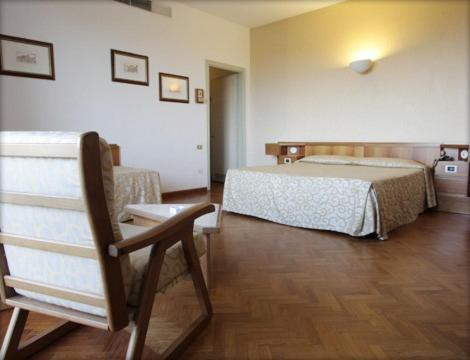 Postel nebo postele na pokoji v ubytování Grand Hotel Golf