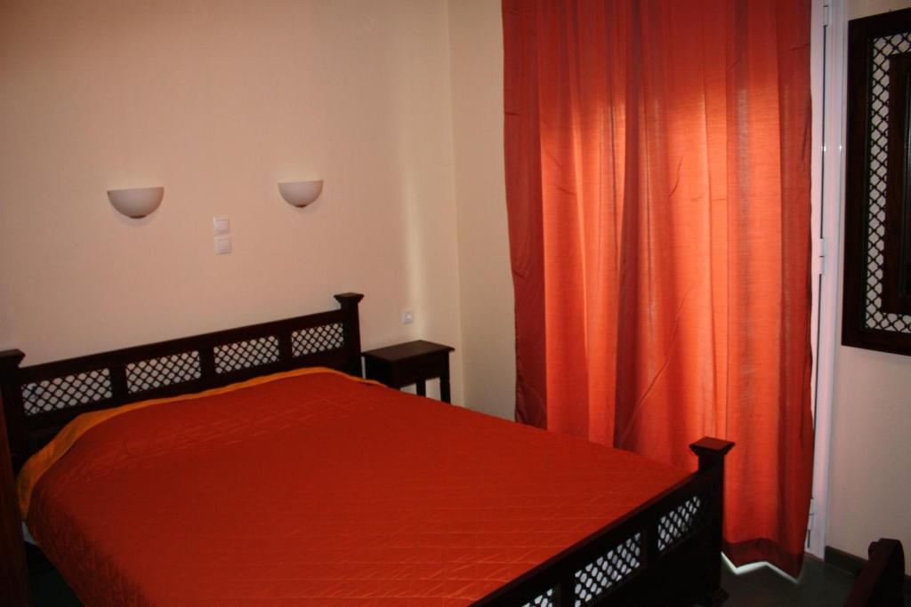 Ένα ή περισσότερα κρεβάτια σε δωμάτιο στο Διόνυσος