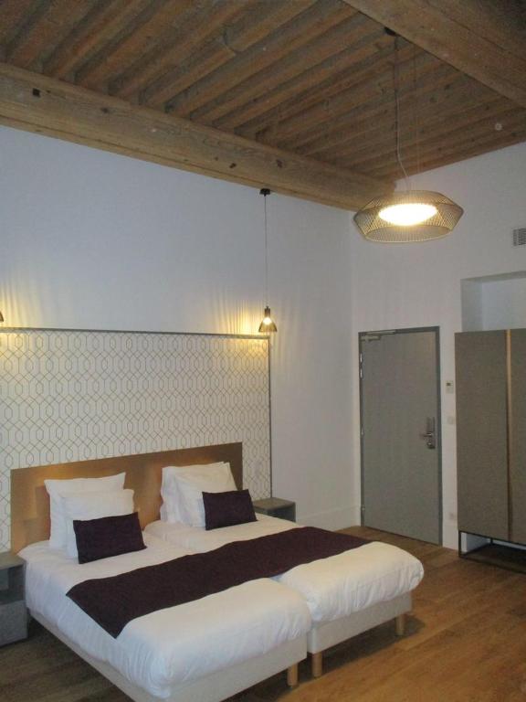 Postel nebo postele na pokoji v ubytování Hotel Saint Vincent