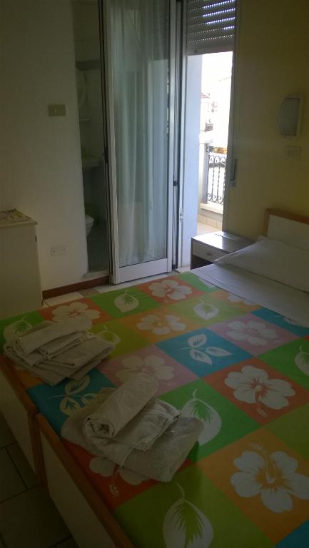 Postel nebo postele na pokoji v ubytování Albergo Maria Gabriella