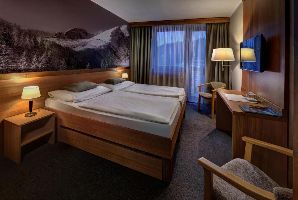 Postel nebo postele na pokoji v ubytování Hotel FIS