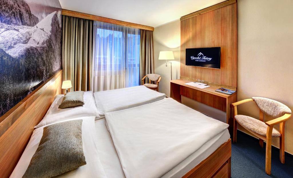 Postel nebo postele na pokoji v ubytování Hotel FIS