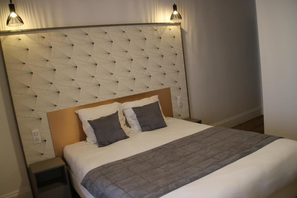 Postel nebo postele na pokoji v ubytování Hotel Saint Vincent