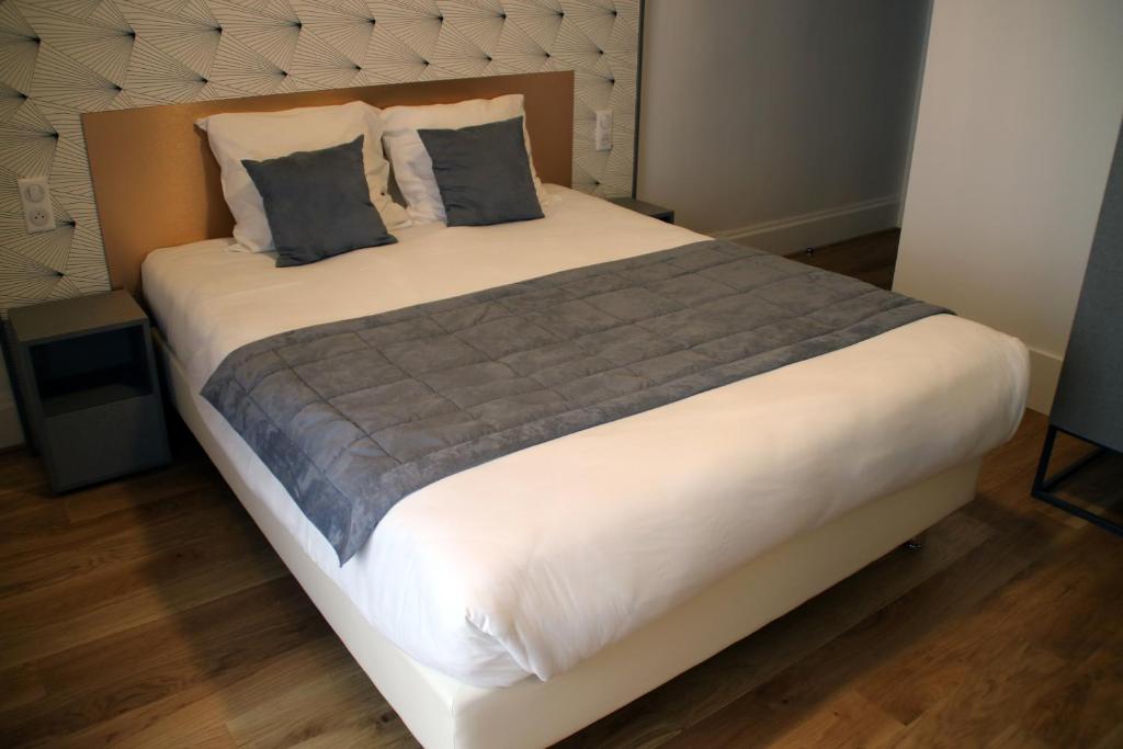 Postel nebo postele na pokoji v ubytování Hotel Saint Vincent