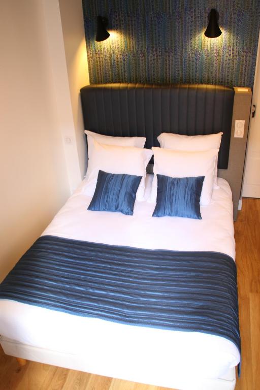 Postel nebo postele na pokoji v ubytování Hotel Saint Vincent