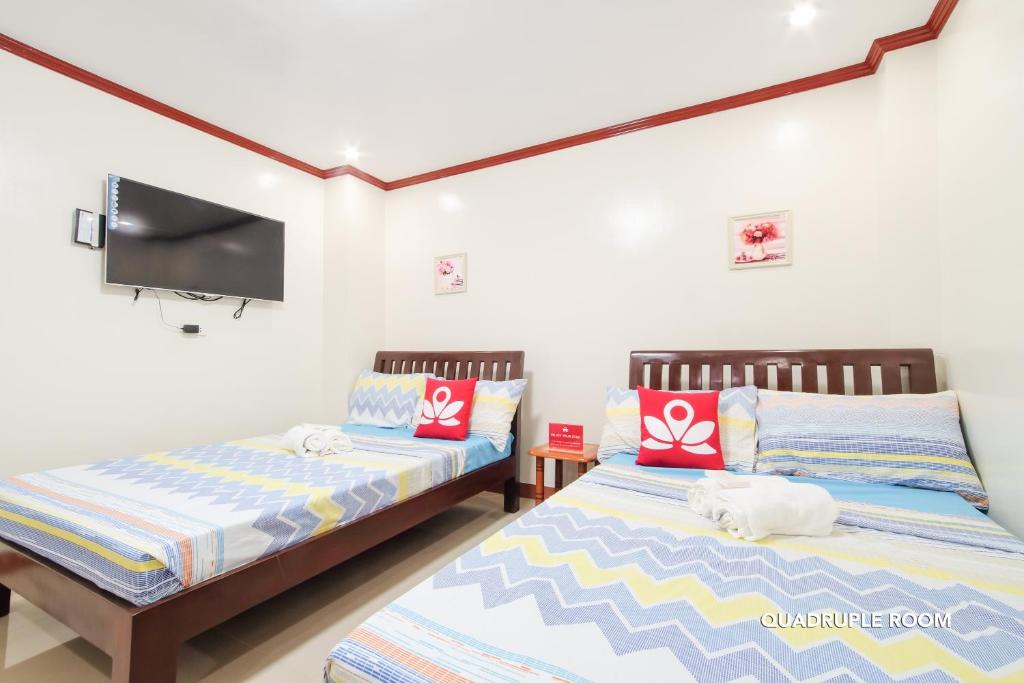 Postel nebo postele na pokoji v ubytování Hotel Georgina