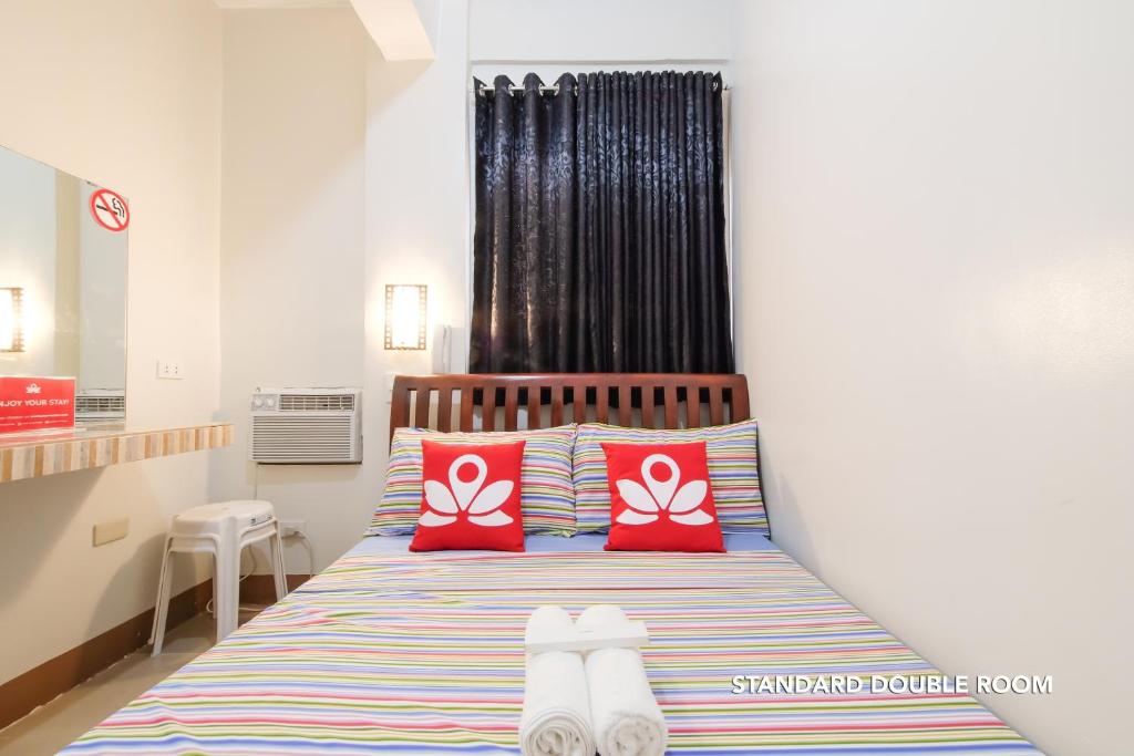 Postel nebo postele na pokoji v ubytování Hotel Georgina