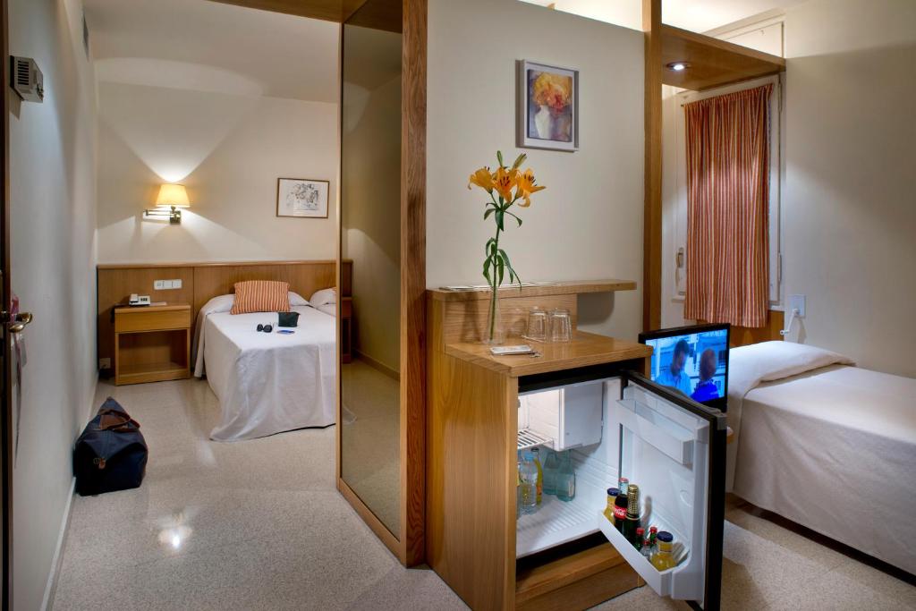 Postel nebo postele na pokoji v ubytování Hotel Restaurant Bon Retorn