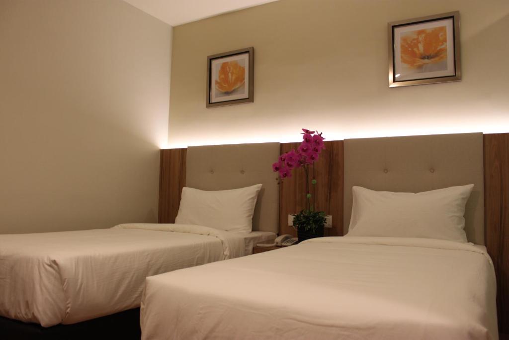 Postel nebo postele na pokoji v ubytování BIG M Hotel