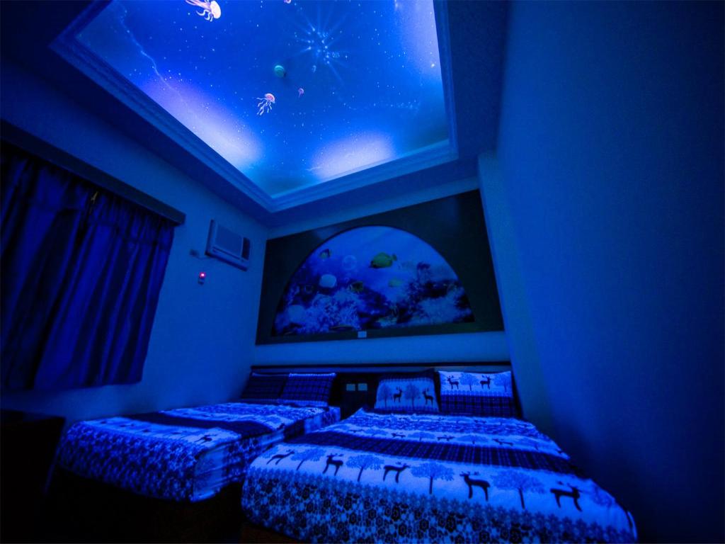 Postel nebo postele na pokoji v ubytování Blue Sea Romance B&B