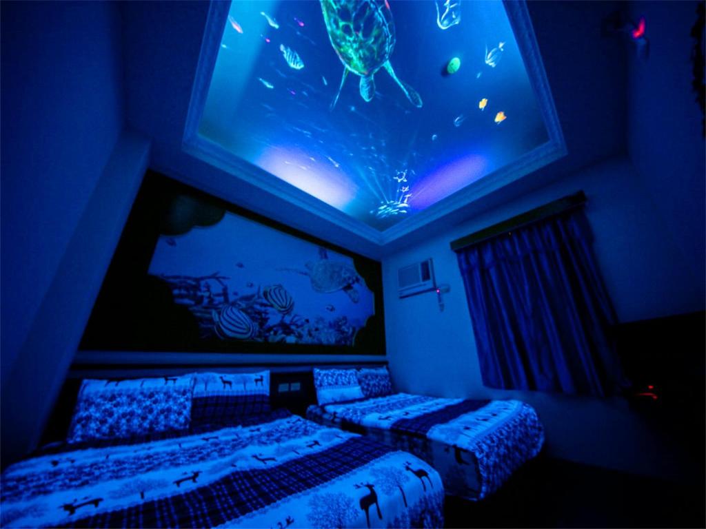 Postel nebo postele na pokoji v ubytování Blue Sea Romance B&B
