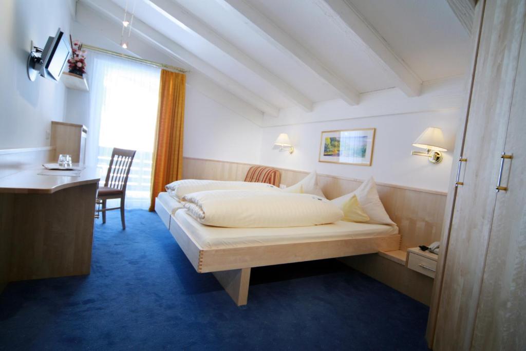 Postel nebo postele na pokoji v ubytování Hotel Wagner