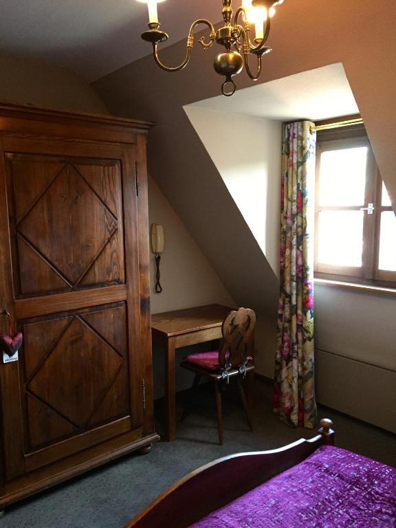 Postel nebo postele na pokoji v ubytování Hôtel Berceau Du Vigneron