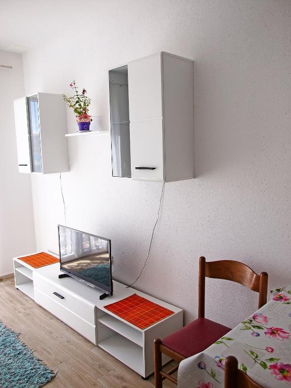 Kuchyň nebo kuchyňský kout v ubytování Apartments Pomalo
