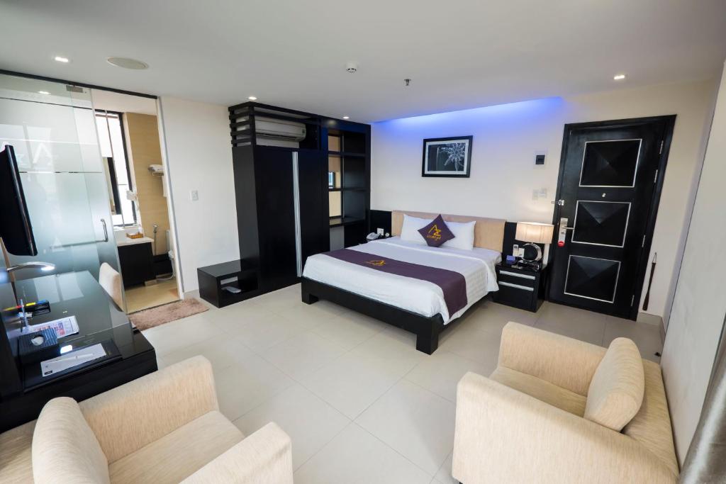 Postel nebo postele na pokoji v ubytování Azumaya Hotel Da Nang