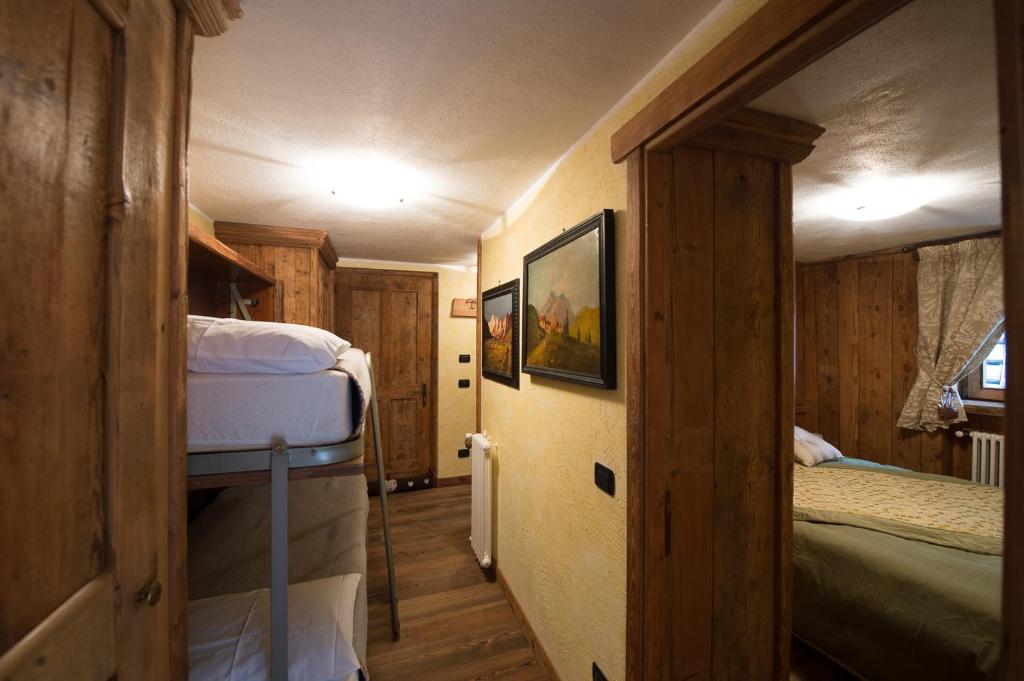 Postel nebo postele na pokoji v ubytování Bellavista Cogne Apartment