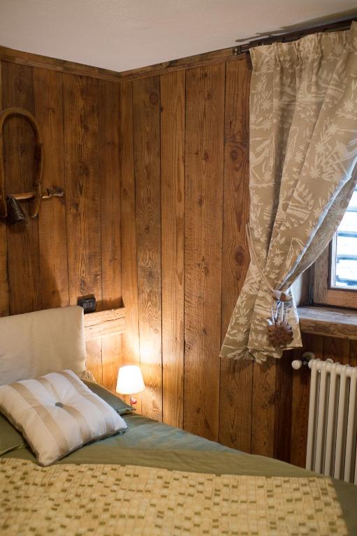 Postel nebo postele na pokoji v ubytování Bellavista Cogne Apartment