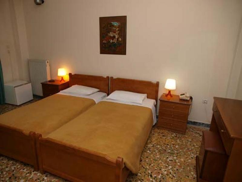 Postel nebo postele na pokoji v ubytování Hotel Markos