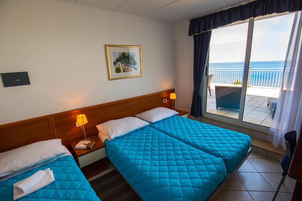 Postel nebo postele na pokoji v ubytování Splendid Resort