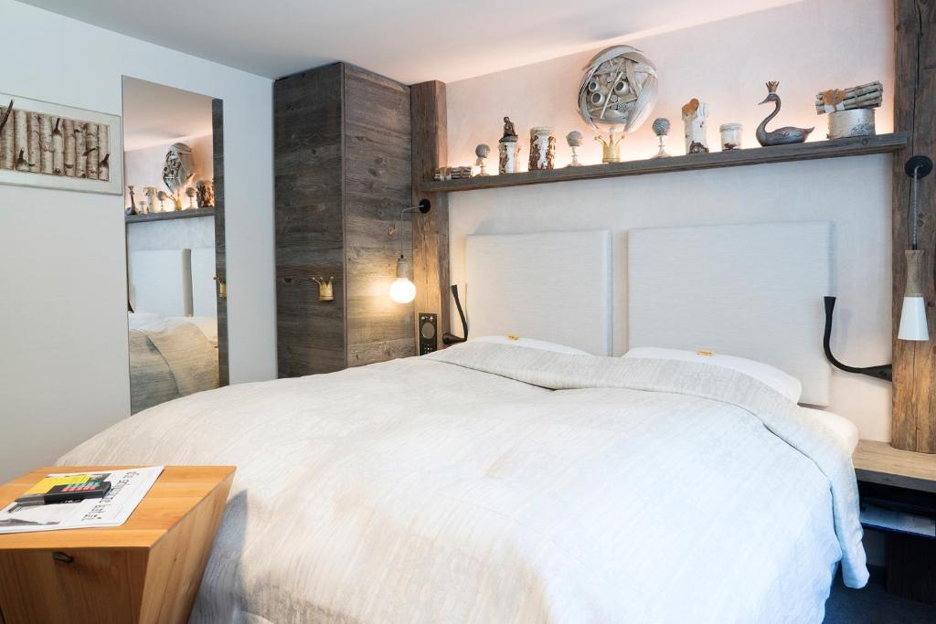 Postel nebo postele na pokoji v ubytování Boutique Hotel im Auracher Löchl
