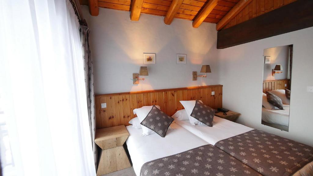 Postel nebo postele na pokoji v ubytování L'Annexe