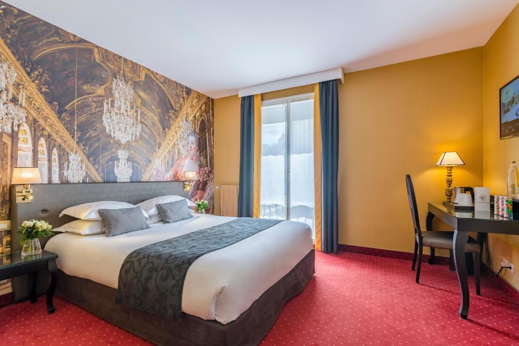 Cama o camas de una habitación en Hôtel Le Versailles