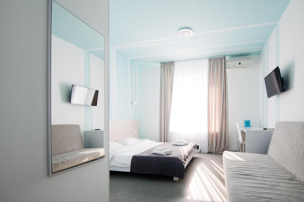 Postel nebo postele na pokoji v ubytování Volna Hotel