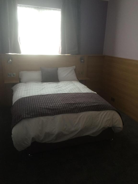 Postel nebo postele na pokoji v ubytování Kennedys B&B Drumcondra