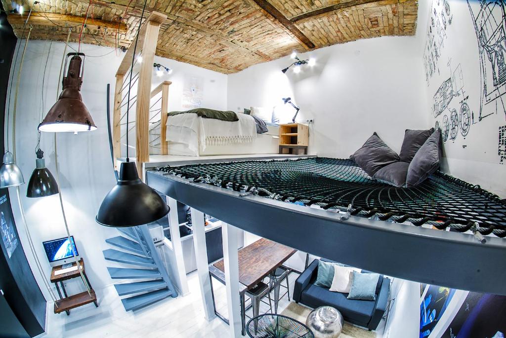 a room with a bed in the middle of it at Designer loft at the Great Synagogue in Budapest