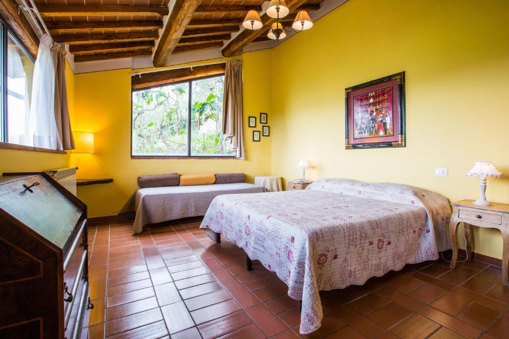 A bed or beds in a room at Agriturismo La Villa Romita