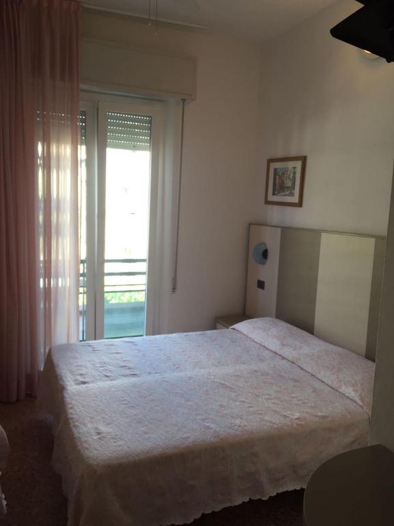Postel nebo postele na pokoji v ubytování Hotel Barbiani