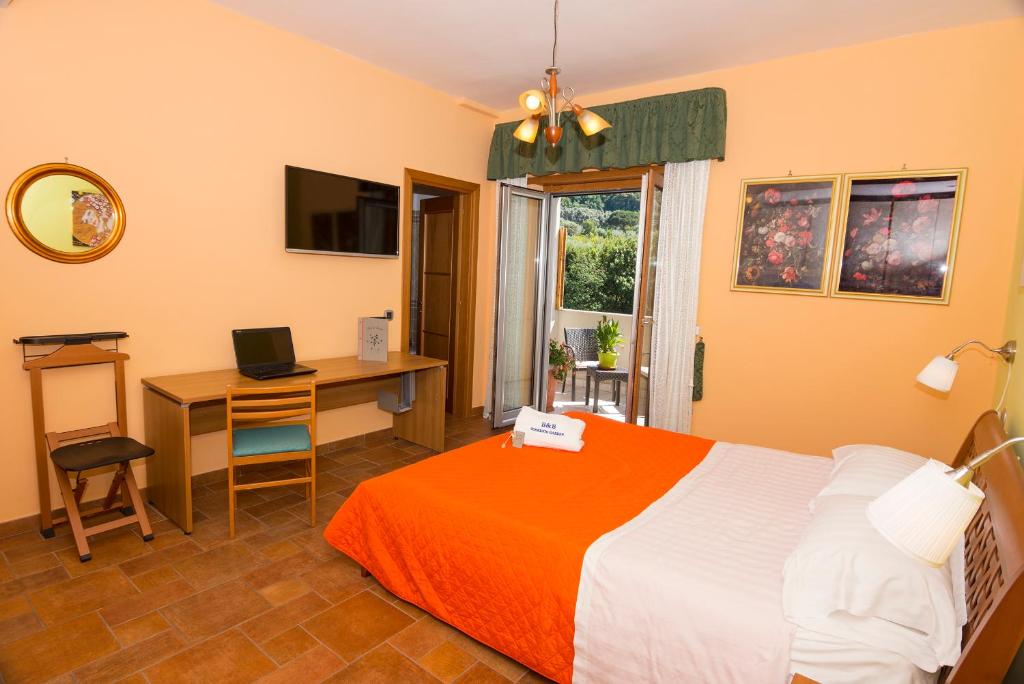 Postel nebo postele na pokoji v ubytování b&b Sorrento Garden