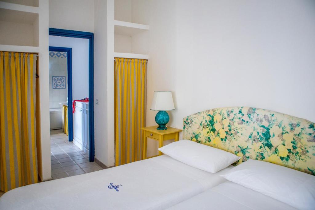 Postel nebo postele na pokoji v ubytování Hotel Piccolo Mondo