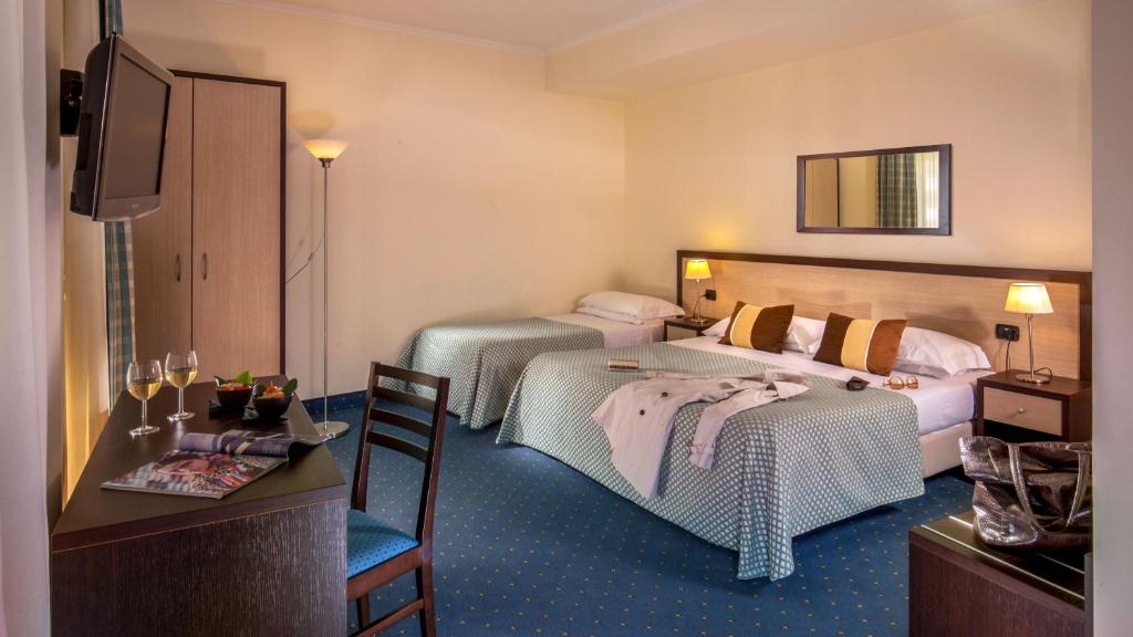 Postel nebo postele na pokoji v ubytování Resort La Rocchetta