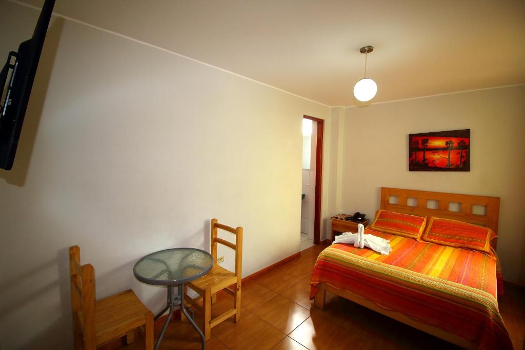 Postel nebo postele na pokoji v ubytování Takora Inn