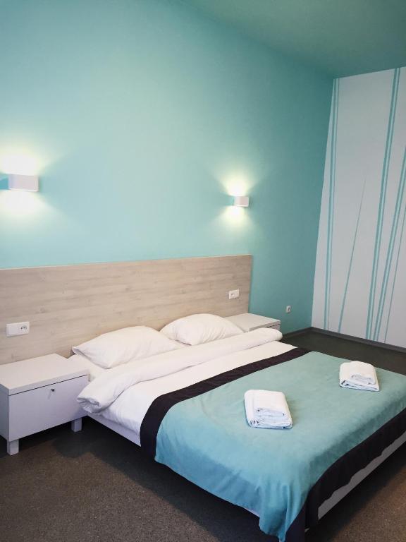 Postel nebo postele na pokoji v ubytování Volna Hotel