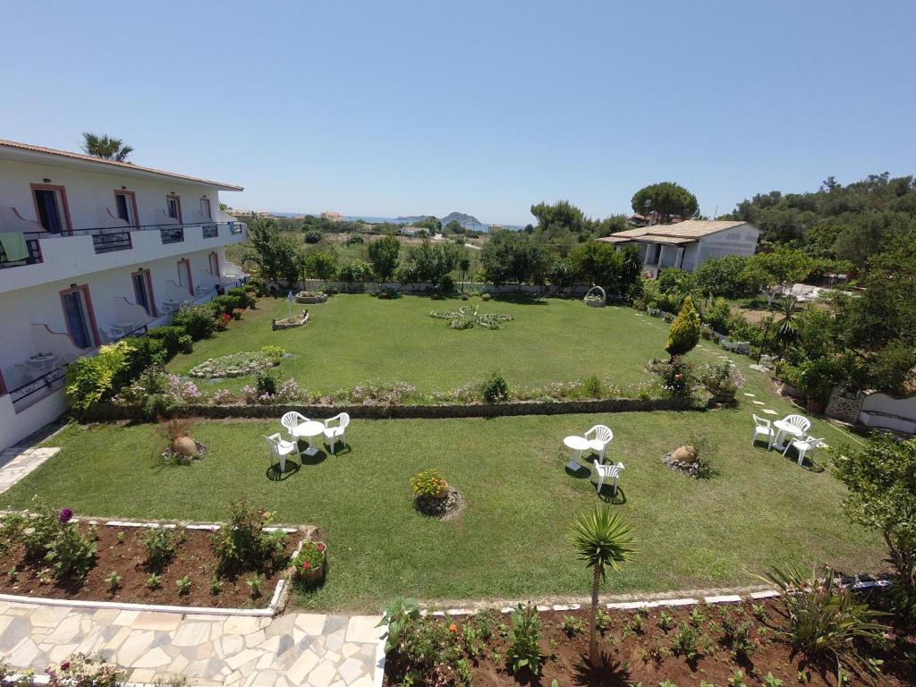 an aerial view of a garden with tables and chairs at Irene Studios in Arillas