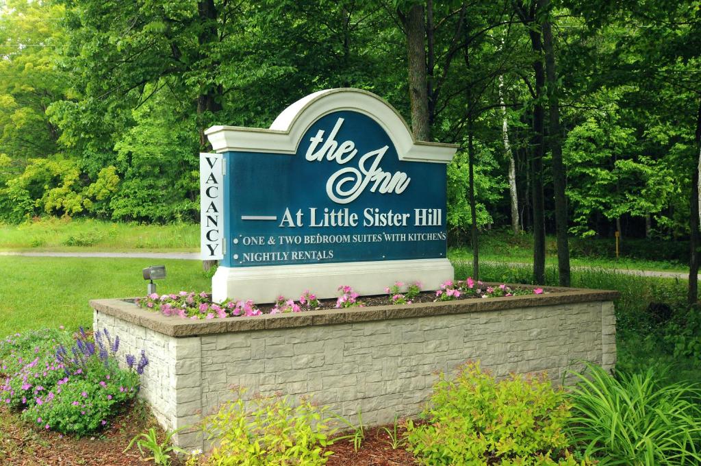 a sign for the gym at little sister hill at The Inn at Little Sister Hill in Sister Bay